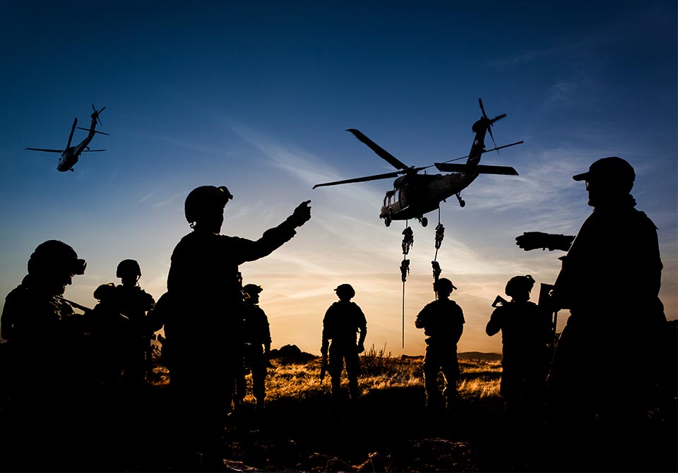 alt=silhouettes of soldiers during a mission