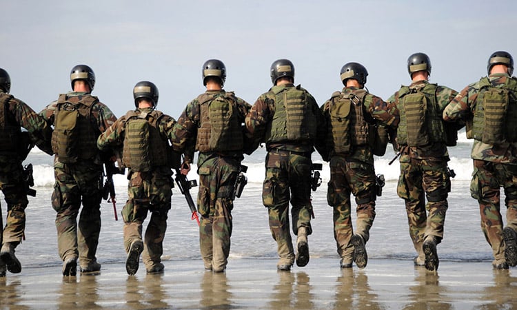 Photo: Armed forces members walking in a line