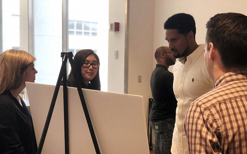 Photo: Battelle co-op students demonstrating expertise in poster session