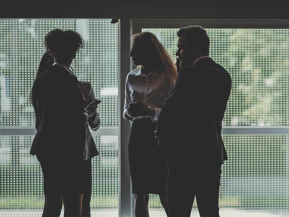 Commerical-call-out alt=business partners meeting at a conference