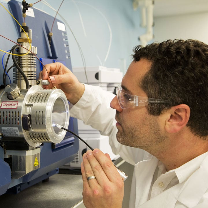 Partner with Battelle Photo: Battelle environmental expert working in lab