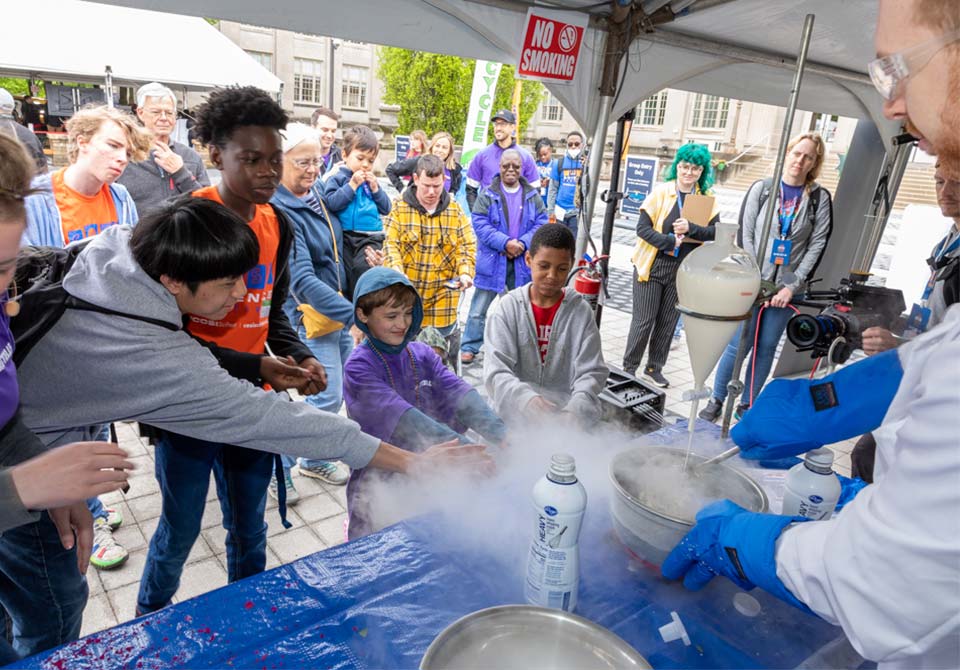 Photo: stem students participating in an experiement at the cosi science festival