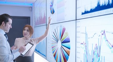 data-analytics-expertise-thumb Photo: Two data scientists examining a dashboard.