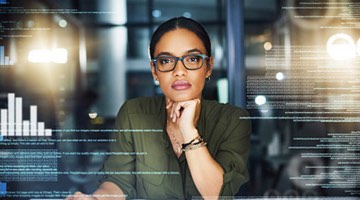 Photo: Data scientist looking at lines of code and data.