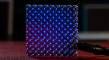 Photo: Metamaterial with glowing blue orbs.