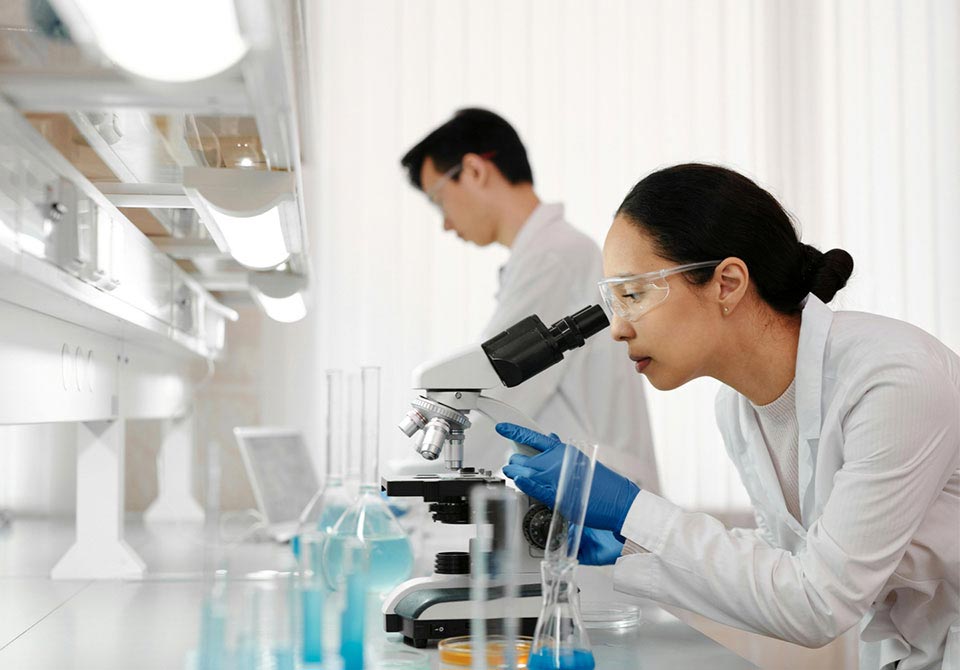 national-laboratory-feature alt=two scientists conducting research in a national laboratory