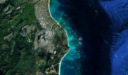 alt= birds eye shot of a coast