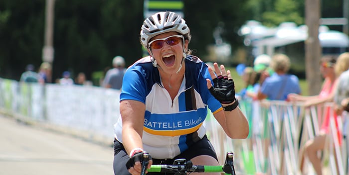 alt= a battelle employee riding a bike