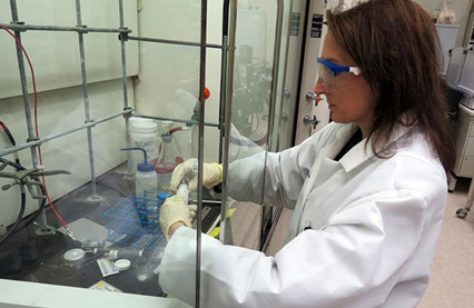alt= amy heintz conducting an experiment