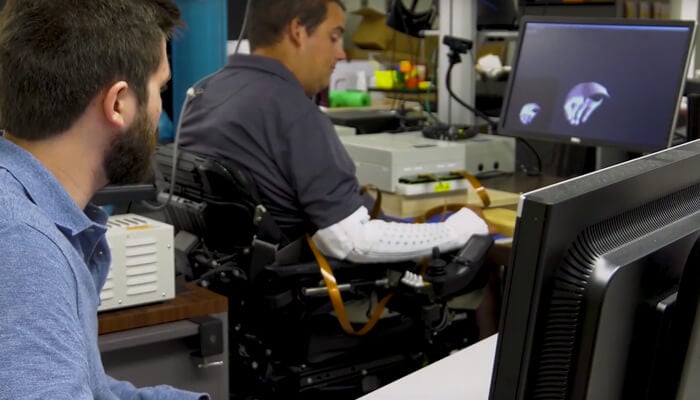 alt=ian burkhart testing the battellle neuro sleeve