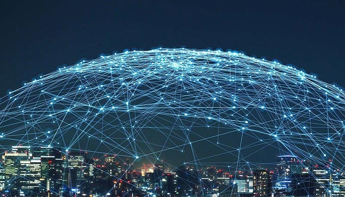 alt= a city skyline with a network dome over top of it