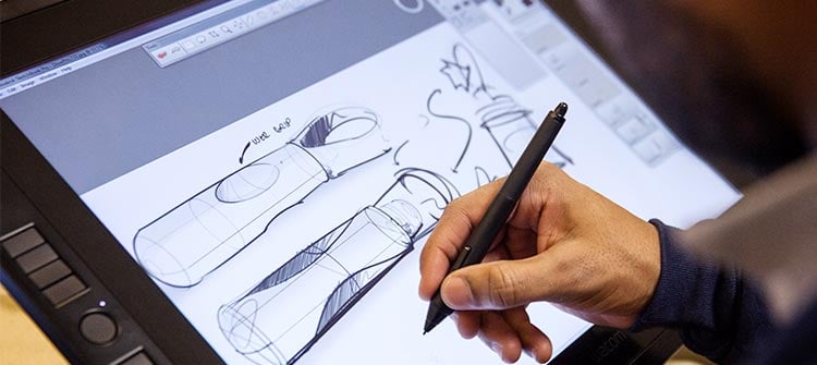 informed-ideation-1 alt = an hcd team member working on a medical device design on a tablet