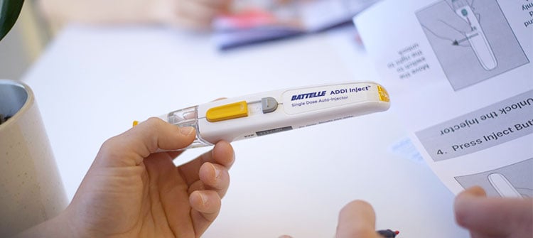 proven-results-1 alt= an hcd engineer holding an battelle addi injector