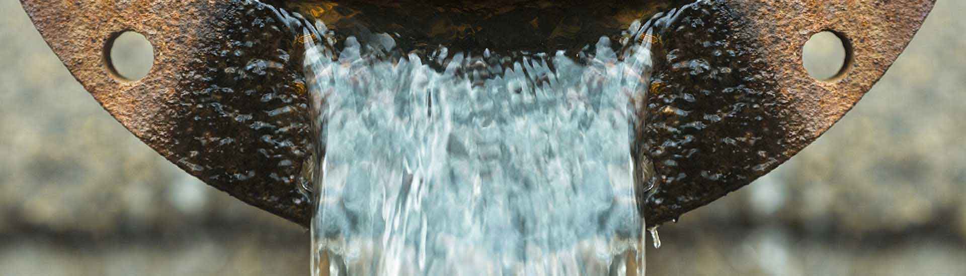Photo: Image of water flowing out of a metal pipe