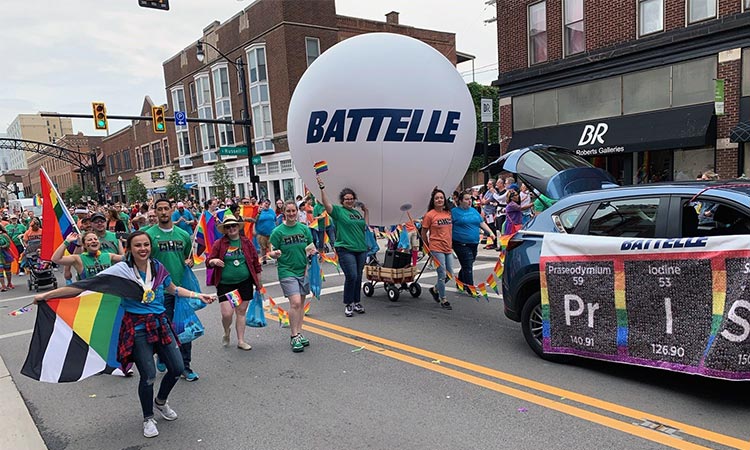 Photo: battelle employees walking in the columbus pride parade