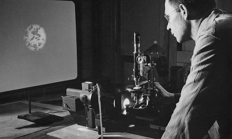 Photo: Battelle researcher examining a metal