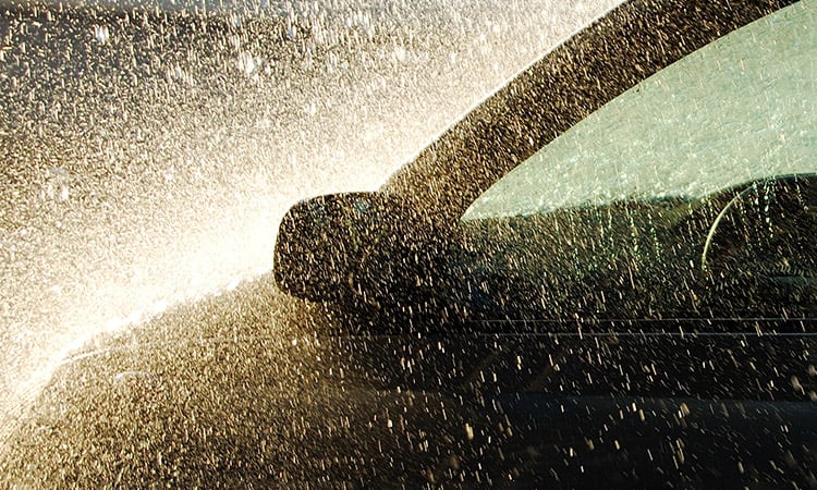 Photo: Side of a car with sparks flying