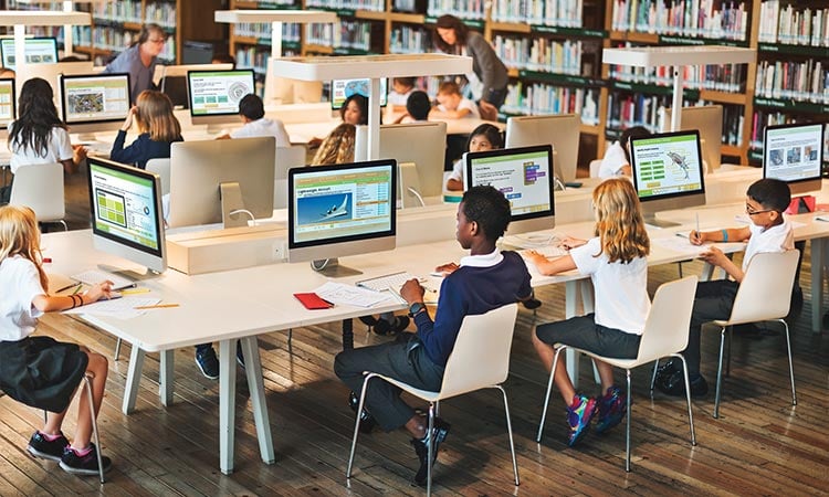 Photo: stem students working in the learning blade library