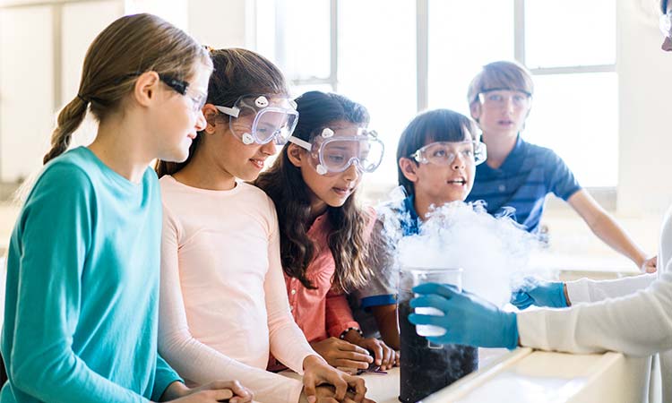 Photo: stem students watching a chemistry demonstration