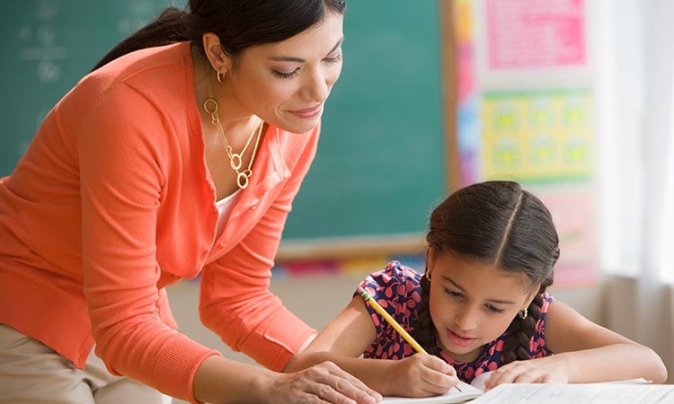 Photo: stem educator helping a stem student