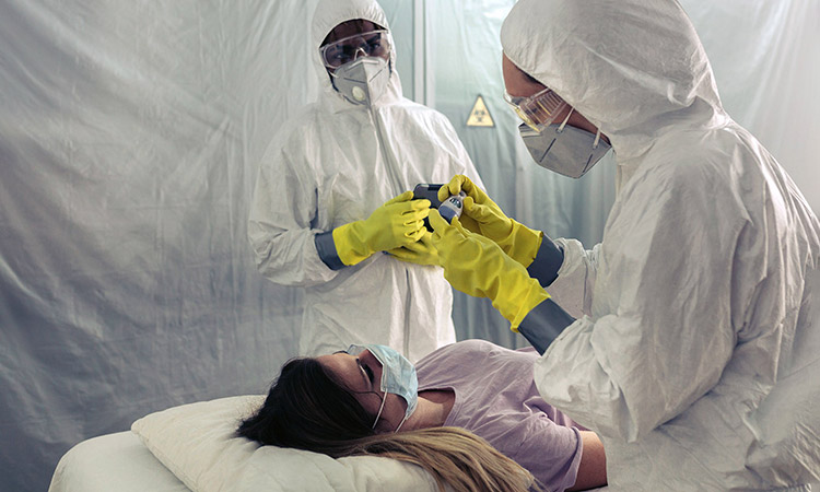 Photo: Healthcare workers administering COVID-19 test