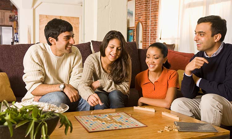 Photo: group of people playing a word board game