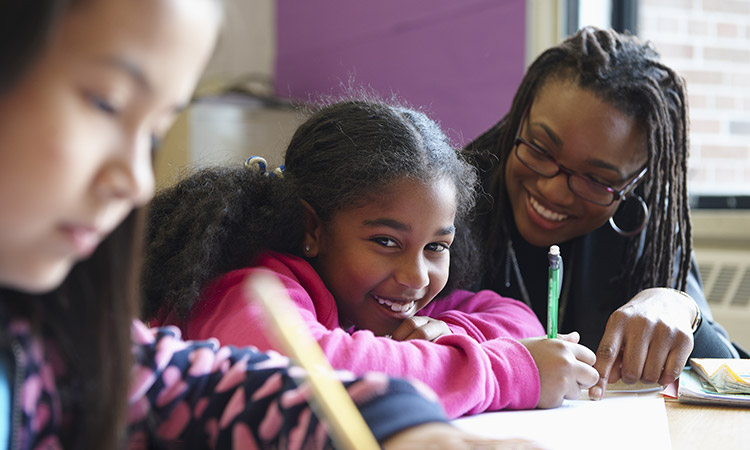 Photo: Adult and child studying