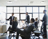 cybersecurity-services-small business people reviewing information on a white board