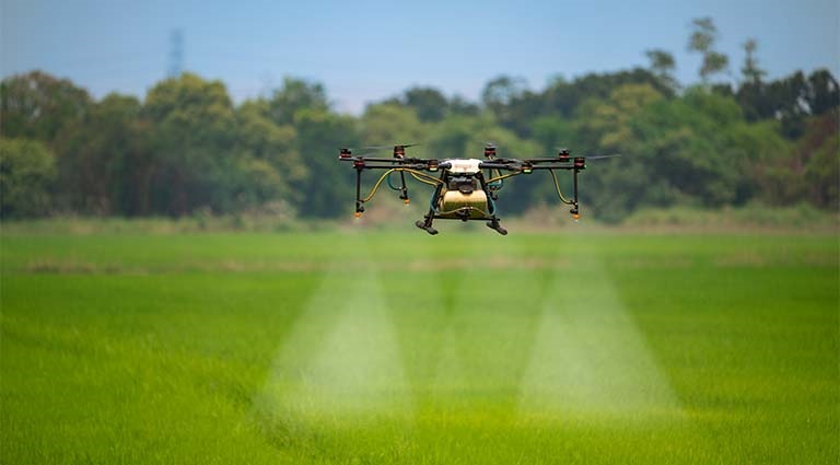 Photo: agriculture drone crop sprayer spraying crops