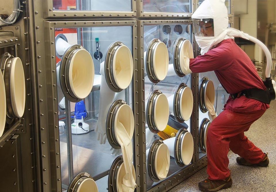 alt=a chemist practicing chemical and biological safety while using the arca chamber
