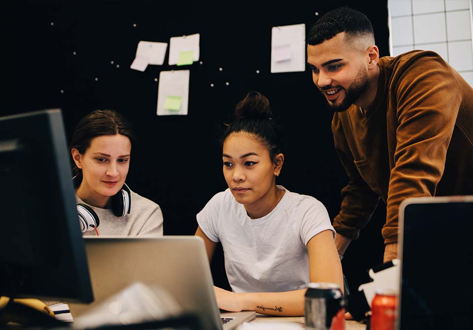 cyber-collab-nccdc Photo: two cybersecurity engineers working together on a task