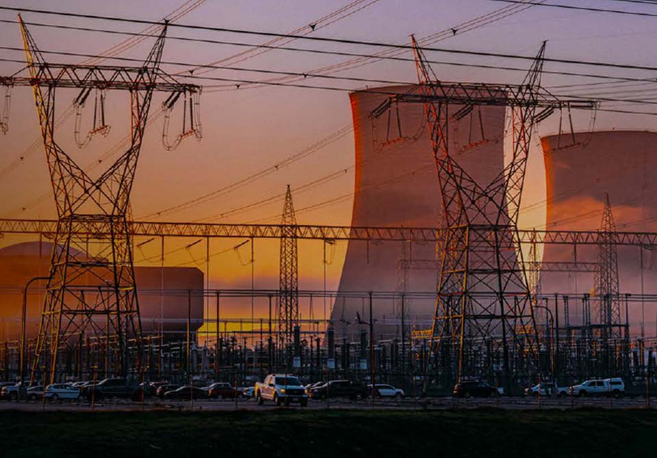 alt= a nuclear power plant at dawn