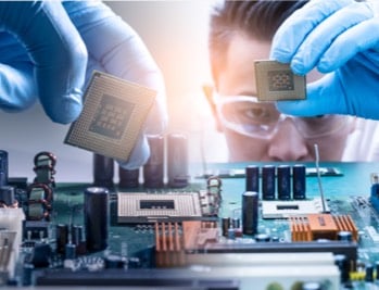 Photo: Battelle Microelectronics technician examining hardware