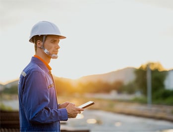 alt=a system engineer working at a power plant