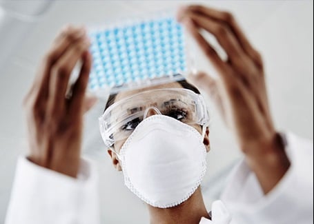 Photo: scientist studying a drug sample