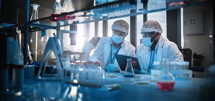 alt= a health researchers in a lab working togehter