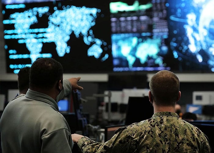 National Security at Battelle Photo: 2 military members discuss data