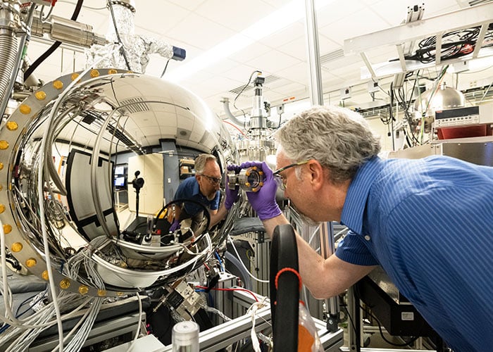 ornl-call-out alt= a scientist at oak ridge national lab working on an experiment