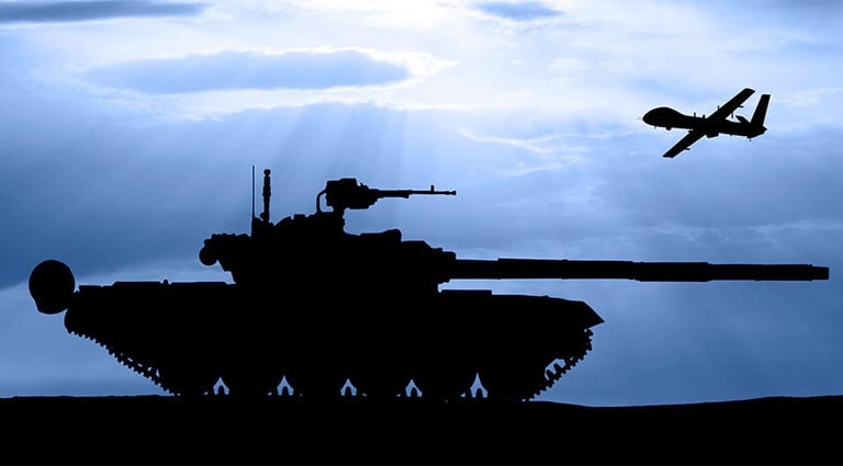 Photo: plane flying over a tank