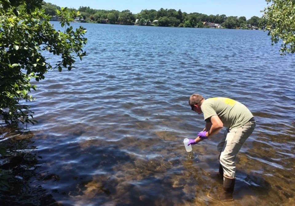 Photo: Battelle PFAS expert taking a sample for HRMS analysis