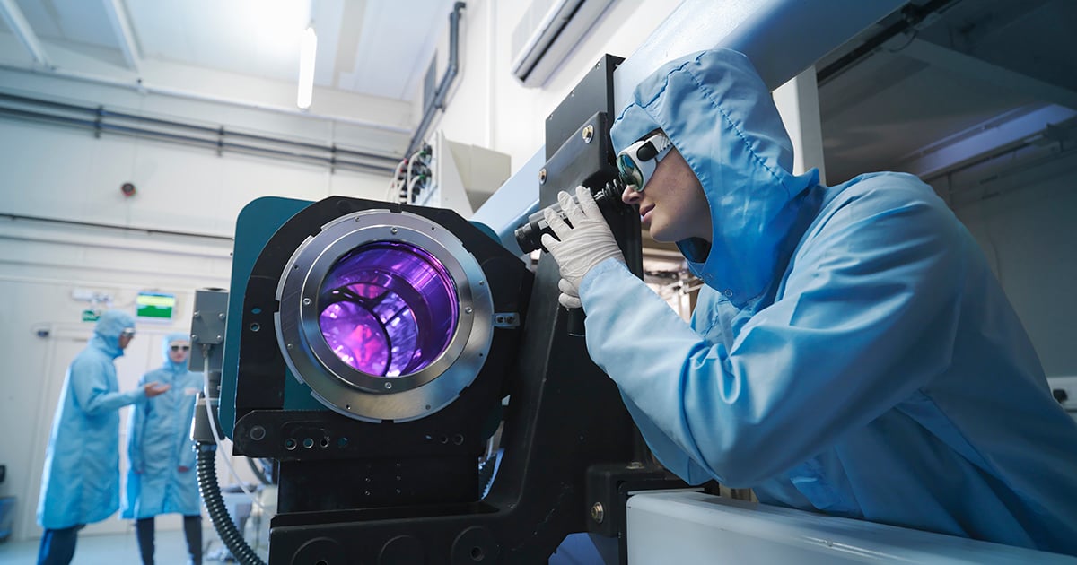 Photo: Scientist in lab using a medical device