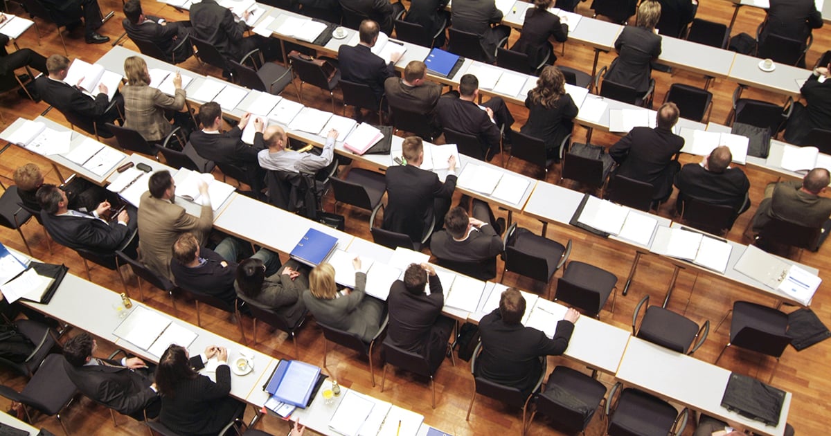 Photo: Group of business men and women in a conference