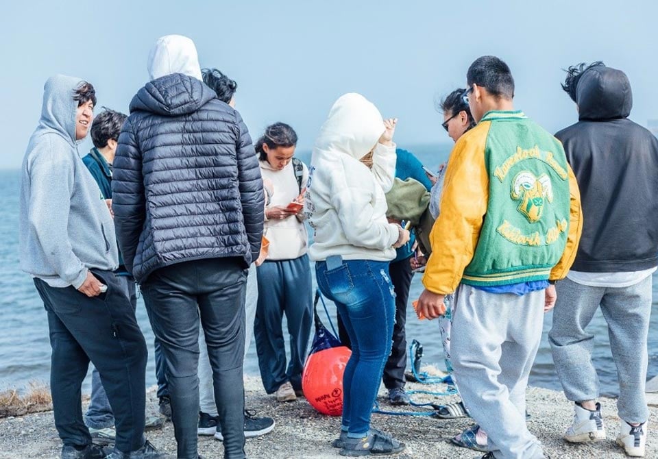 Photo: A group of indigenous arctic people talking to one another