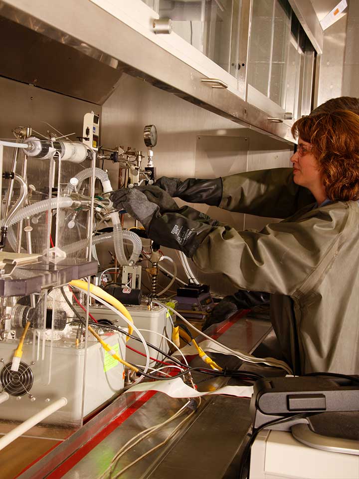 Biosafety Laboratories Photo: scientist conducting experiments in the battelle biomedical research center