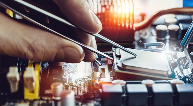 Photo: Battelle researcher doing concolic analysis on hardware