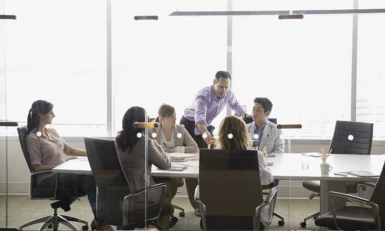 Health Readiness and Response Feature Photo: doctors in a board room discussing data