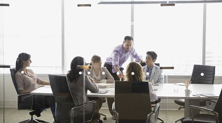 Photo: doctors in a board room discussing data