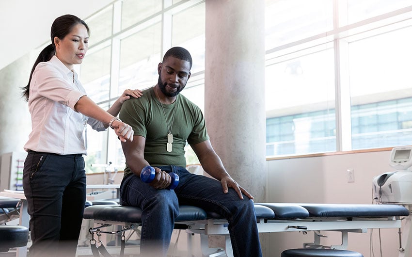 Photo: Armed service member undergoing physical therapy