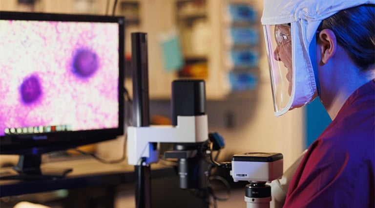 Image: Battelle expert in a biocontainment lab