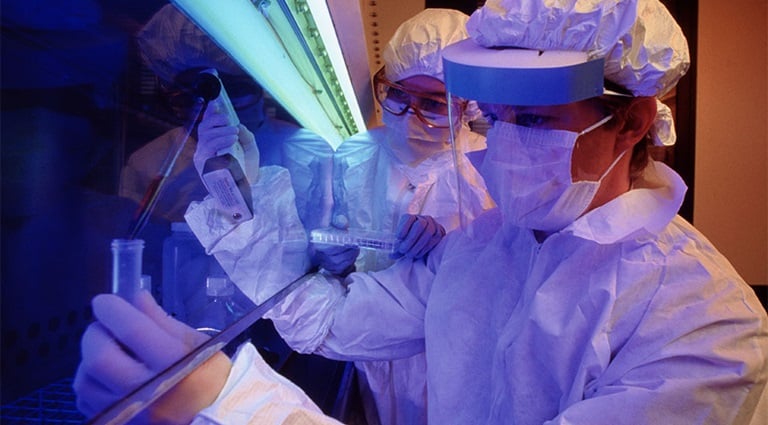 Image: Battelle biologists handling infectious virus sample